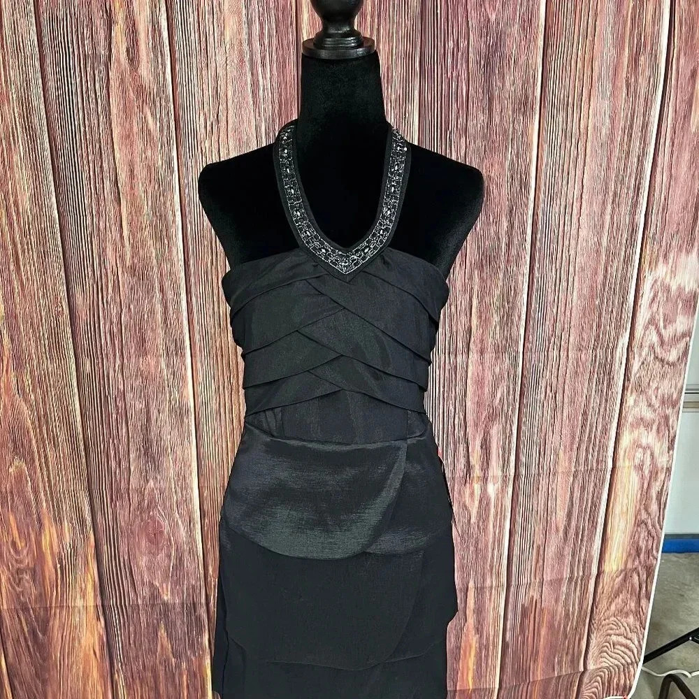 A cute little black dress by Trixxi with a halter neckline! This dress is a ju